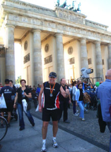 Rick Shaver (pictured front and center in Berlin) says the Berlin marathon finishers get to run through the Brandenburg Gate, with much of the run taking place near or on the location of what was the Berlin Wall.
