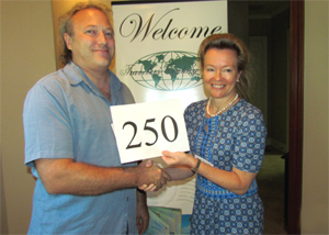 Outgoing Texas coordinator Kim-Kay Randt congratulates Jordan Hargreave for reaching his 250th country.