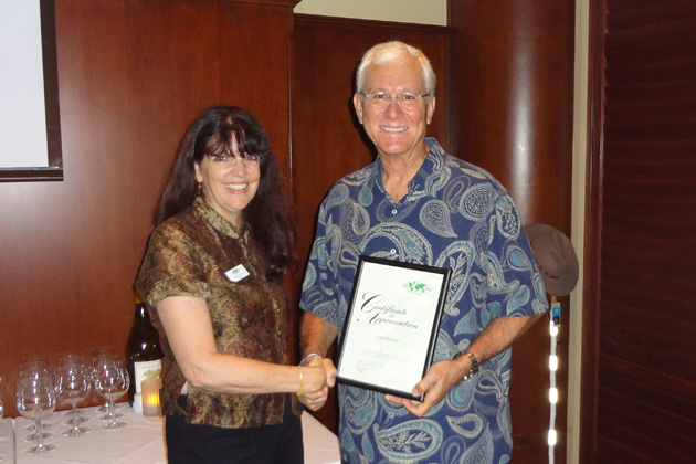 TCC President Pam Barrus presents a certificate to the featured speaker, world-renowned photographer John Rowe, who talked about his foundation that helps the children in Ethiopia’s Omo Valley region.