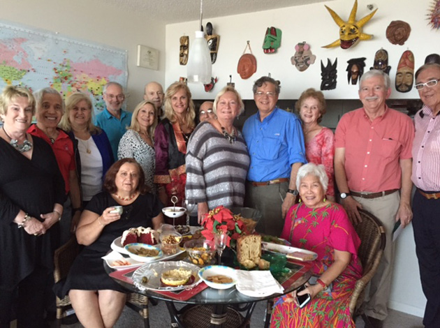 At the December 2015 TCC holiday party in Miami, a fine time was had by all sharing their past and future Travels, and drawing numbers for all wrapped Travel Souvenirs to get and rob each other until end of Gift Exchange! Standing, left to right: Sally Schmillel, Nikos  and Barbara Spanakos, Ted Cookson, Marlene Soloman, Steve Warner, Chapter Coordinator Jan Novar, Cal Rosenbaum, Bev Anderson, Richard Reines, Louise Gross, Leon Hochman and John Novar. Seated: Hostess Anush Dawidjan and Luisa Lu.