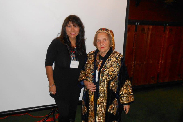 Speaker Lillie Echevarria (left) with Betty Knudson wearing an Uzbek dress