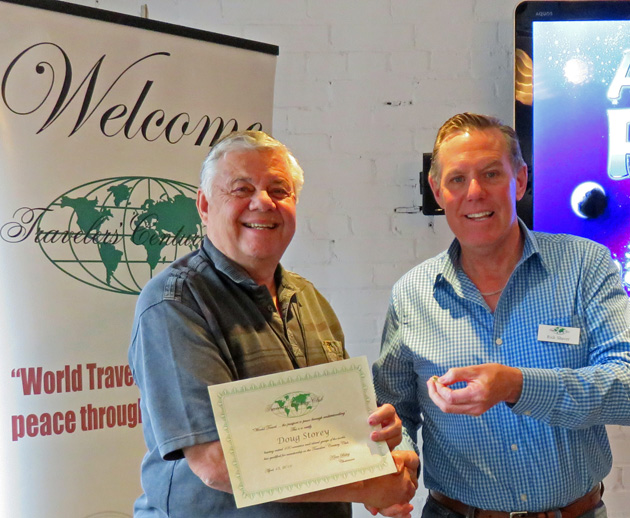 Chapter Coordinator Rick Shaver (right) presents a 100 country certificate to Doug Storey,